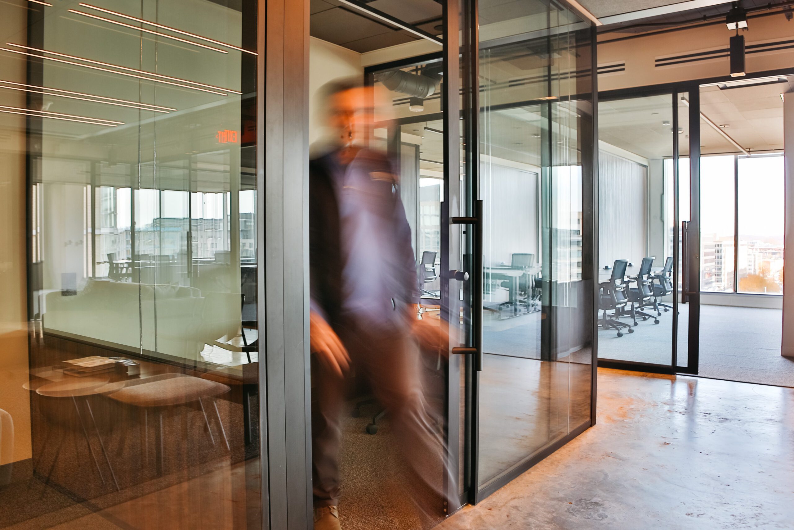 a man walking out of his private office at a coworking space launch workplaces
