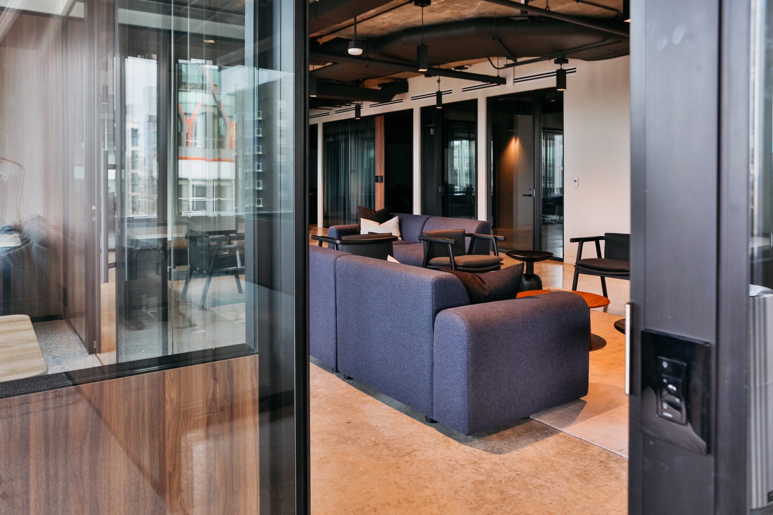 An office space for large companies, complete with a lounging areas and a mix of private offices and open spaces