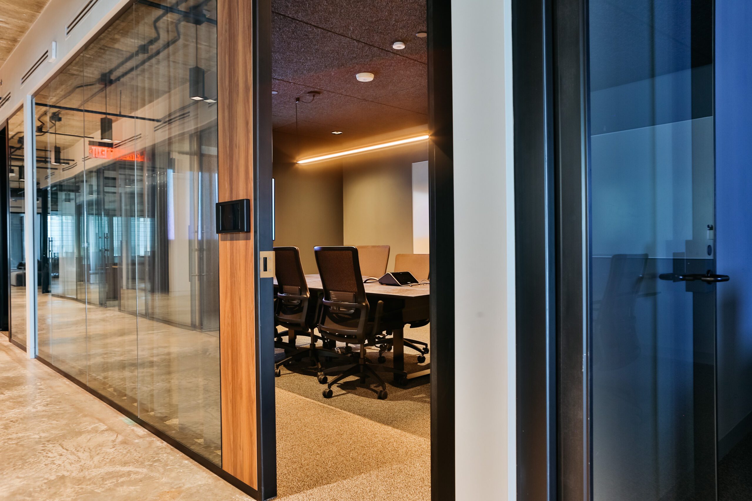 a view looking into a beautiful modern meeting space in DC with privacy nice lighting high end design and decor and av and technology