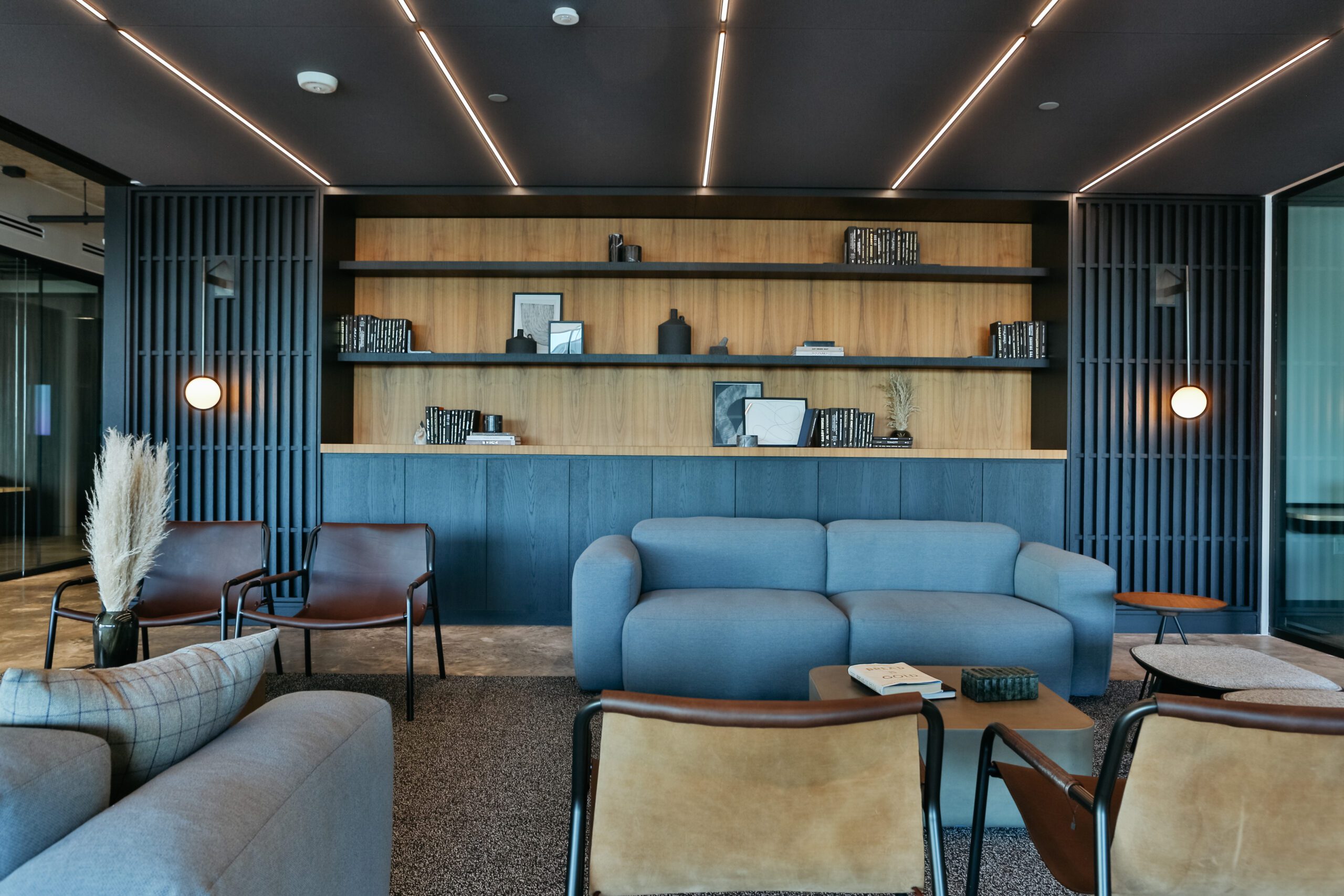 a lunge area inside a flexible workspace featuring beautiful modern design and furniture